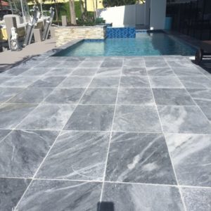 A pool with gray tiles