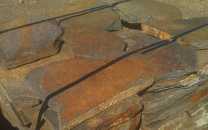 Tied stacks of orange stone blocks