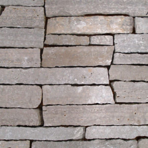 A stone wall with gaps