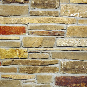 A wall with light brown bricks