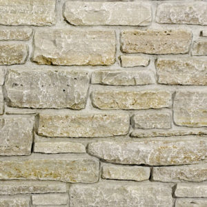 A beige and brown brick wall
