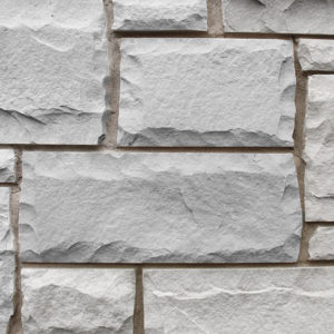 A light gray brick wall